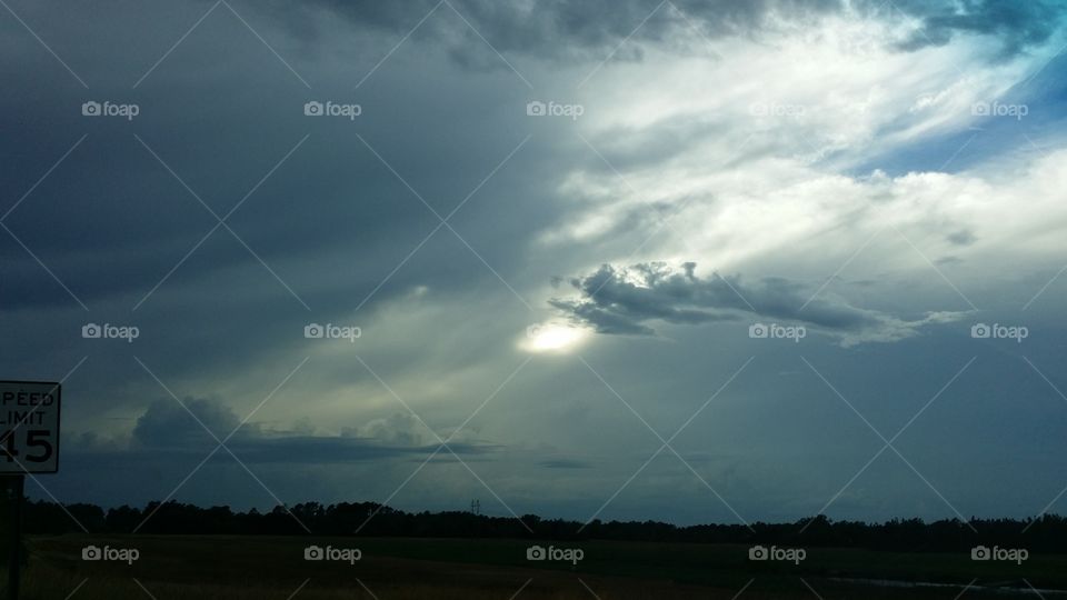 Weird sky. late in the day but not quite sunset yet. it was cloudy and had been raining before I took the photo 