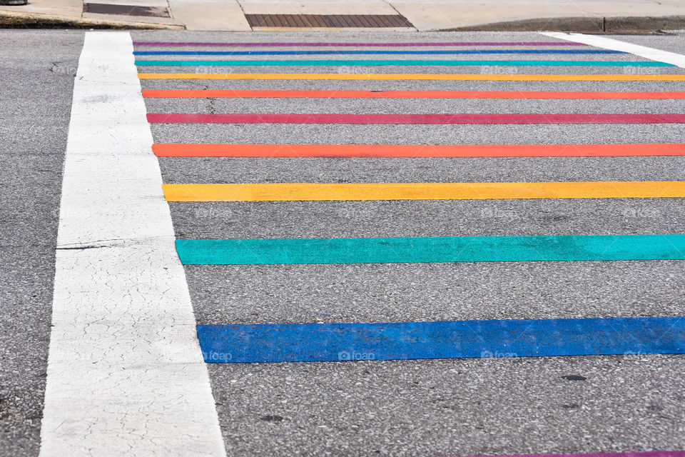 Multi colored rectangular crosswalk lines in the street