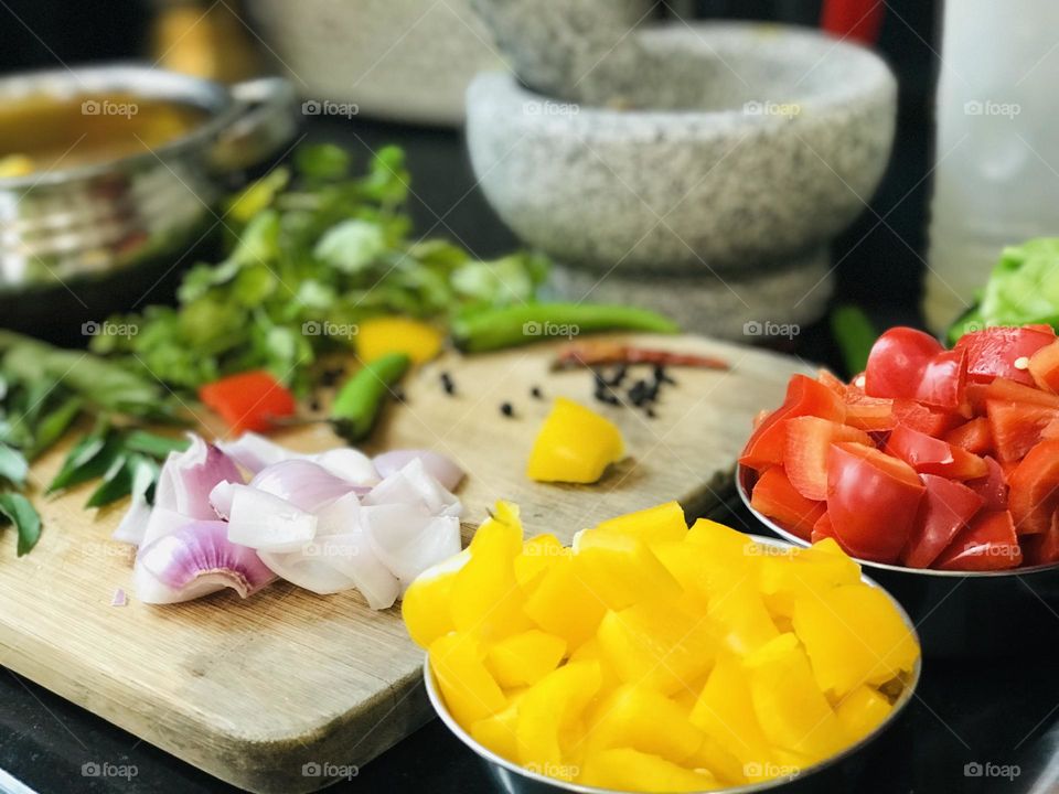  Colourful capsicum in a bowl and hand mixer 