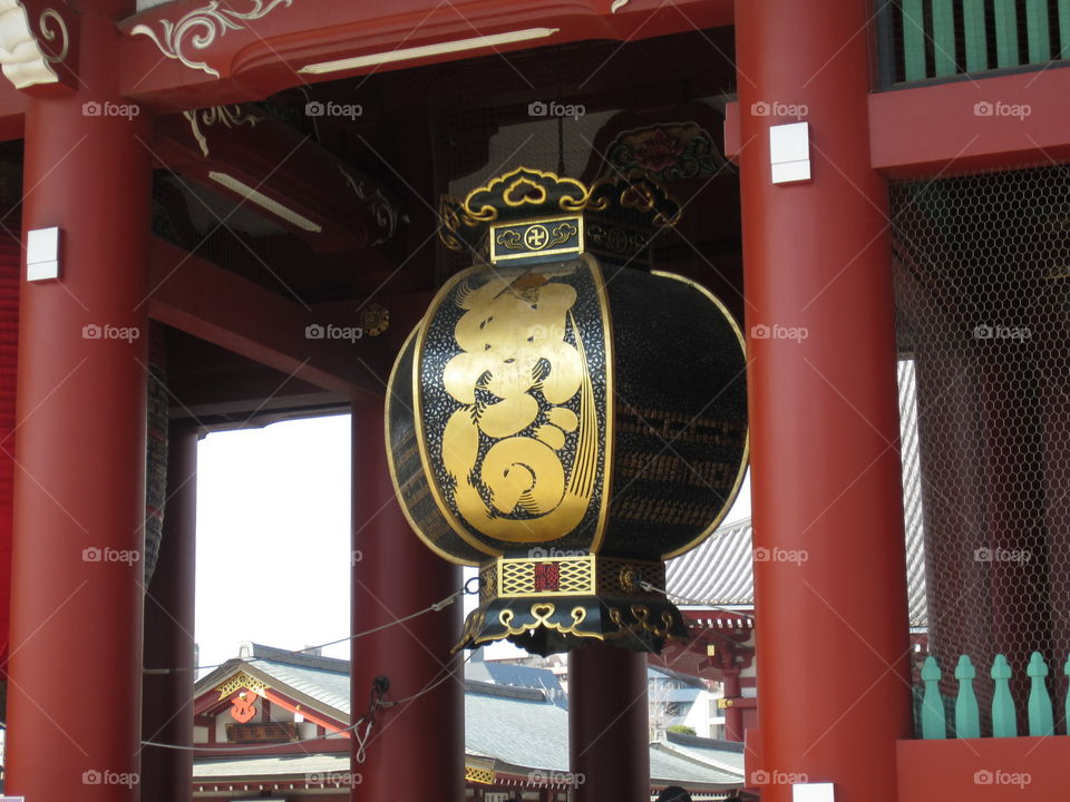 Asakusa Kannon. Sensoji Buddhist Temple and Gardens. Tokyo, Japan.  Black and Gold Giant Lantern at Entrance