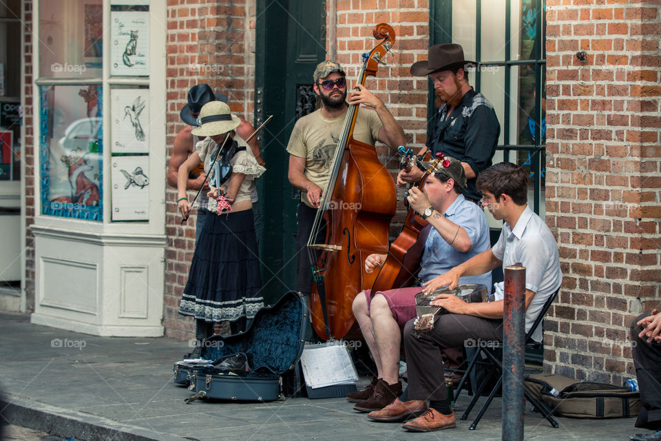 Street performers playing music at French Quarter in New Orleans LA