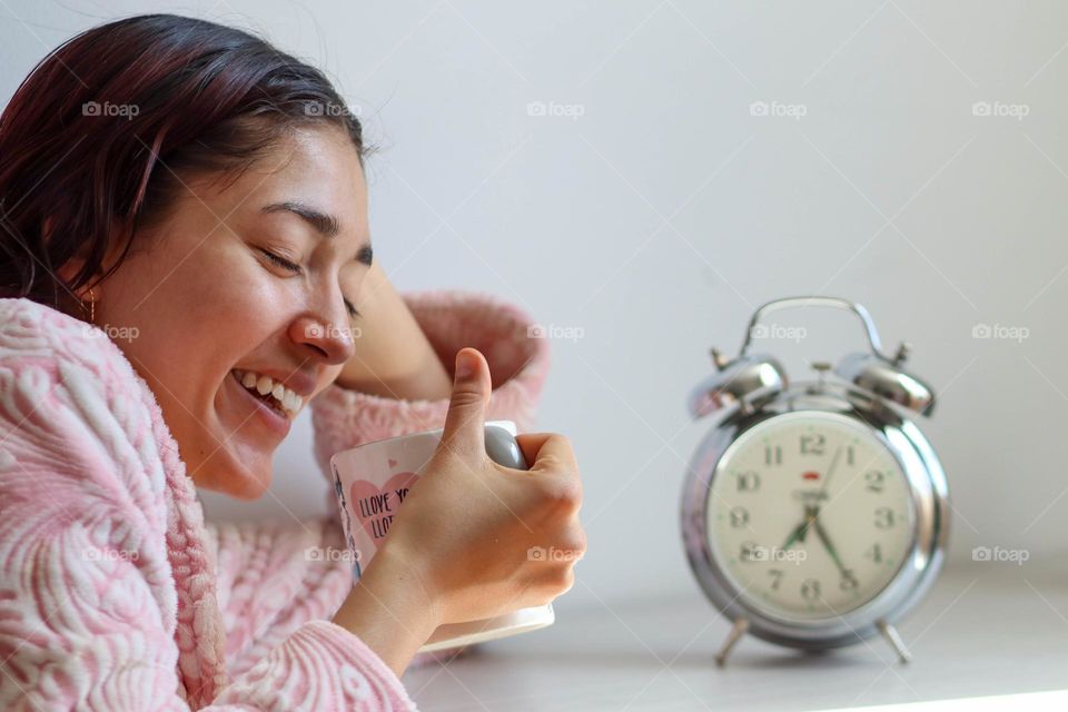 Young woman with a cup of morning coffee