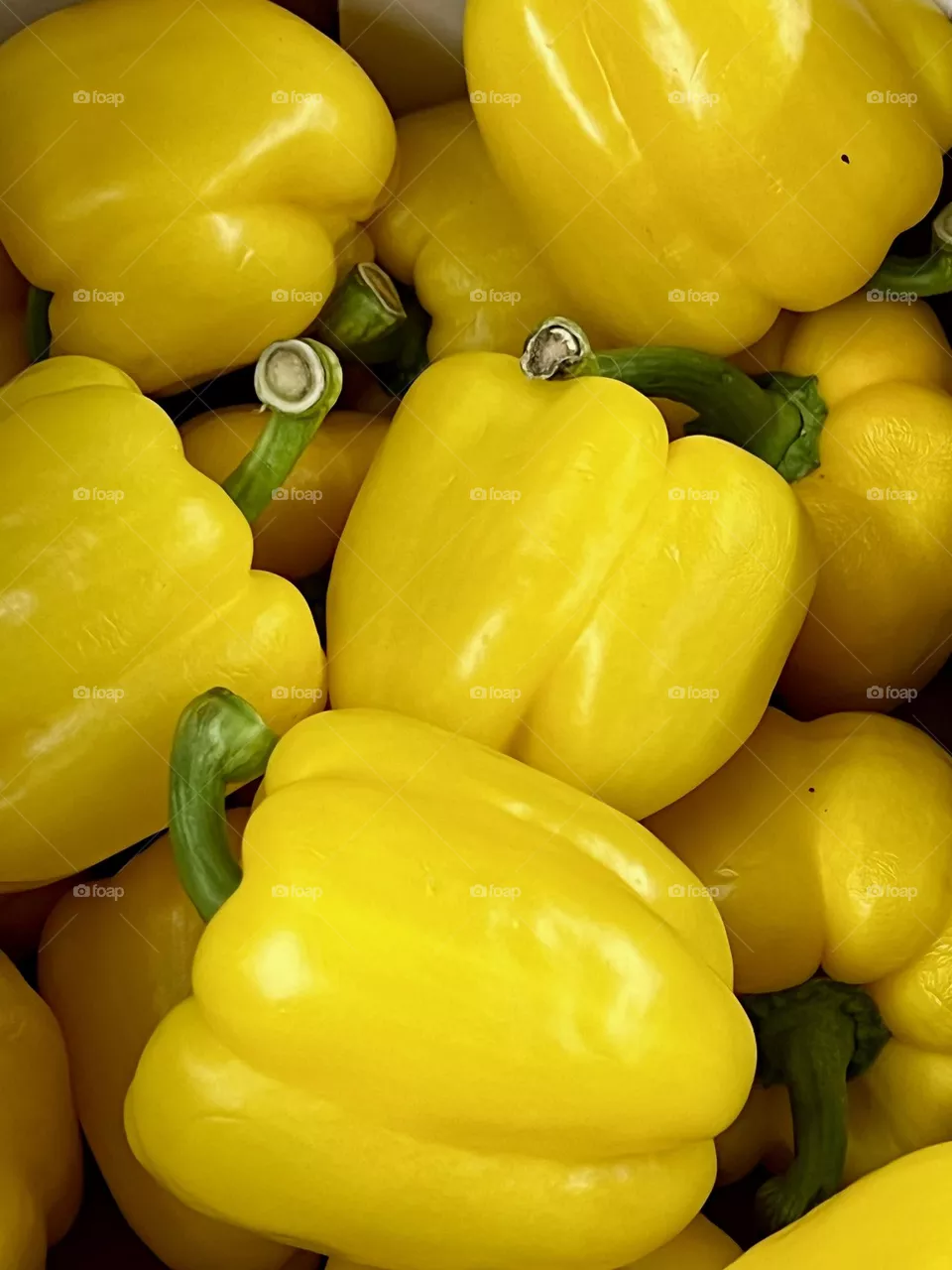 Close-up shot of a yellow pepper in a box. 