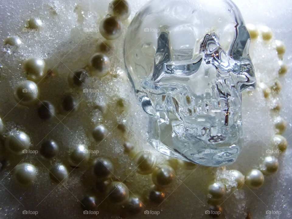 Crystal skull in pearls and snow