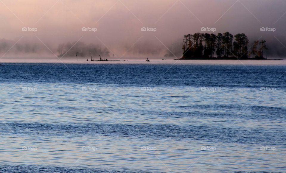 fog rolling in over lake.