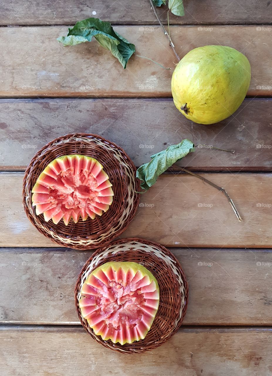 Guavas on the table under sun