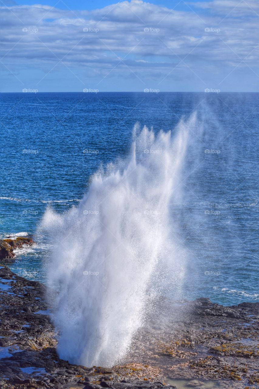 Spouting horn . Memorable moment in Kauai at Spouting Horn, a blowhole in the lava rock