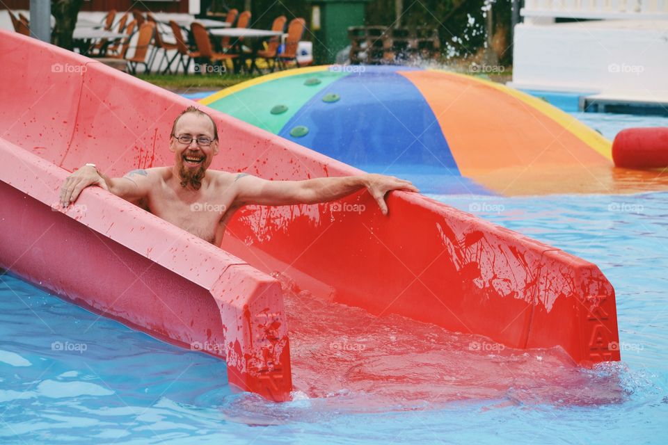 Man going down a water slide