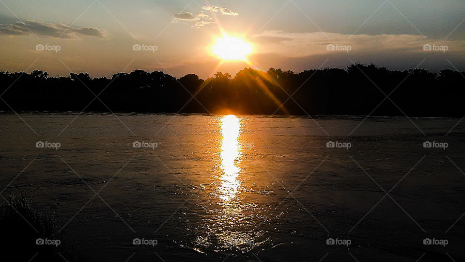 A sunset grazing the waters of the Rio Grande river in Texas