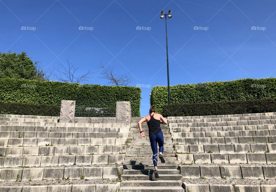 Training outdoors running up the stairs