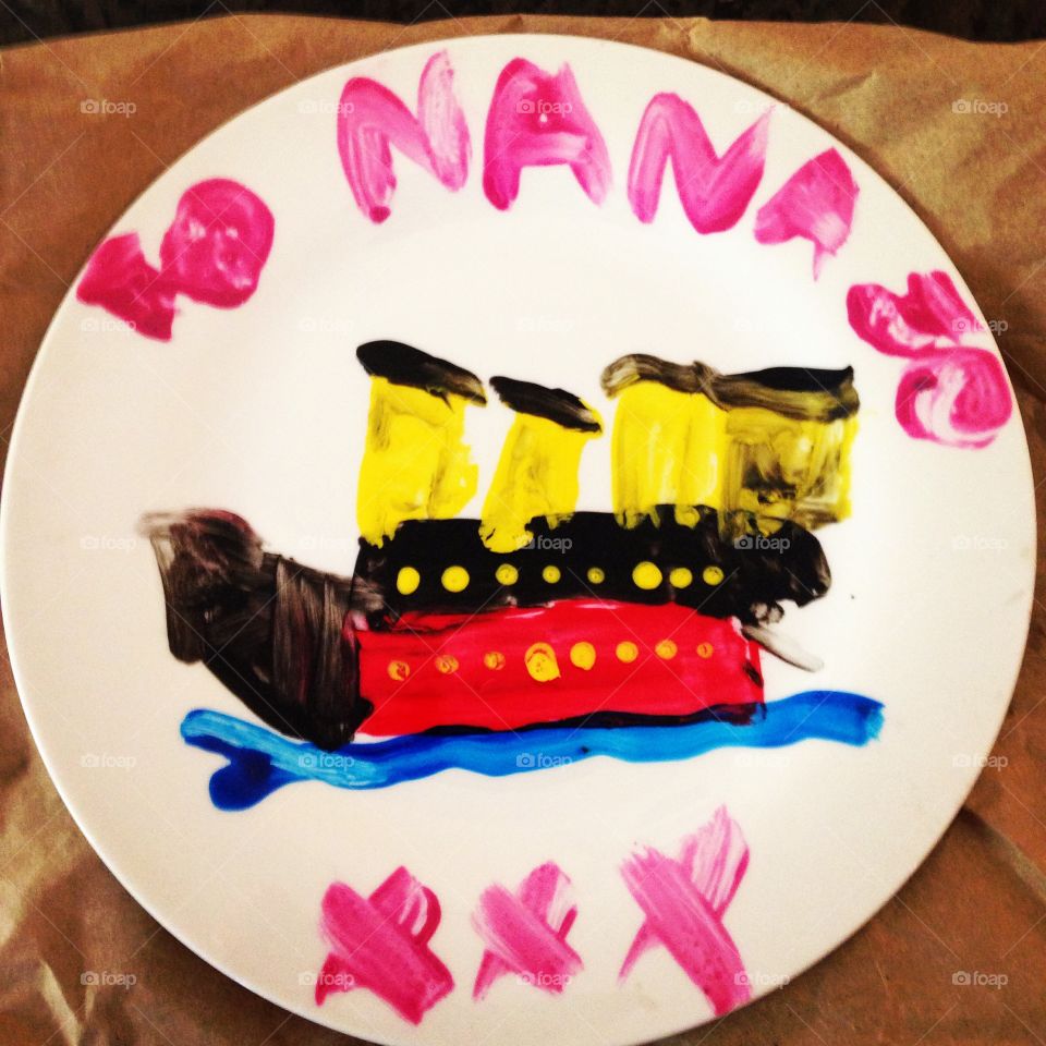 Titanic art age 6. My son painted a plate of the titanic for his nans birthday ❤️