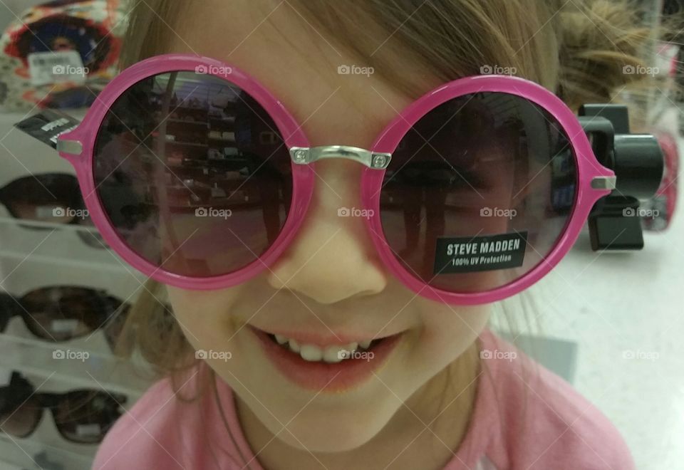 Pink Shades. Trying on a sunglasses at TJ Maxx.