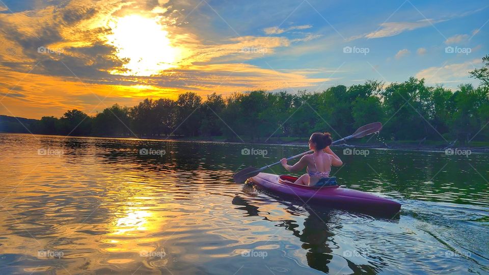 kayaking at sunset
