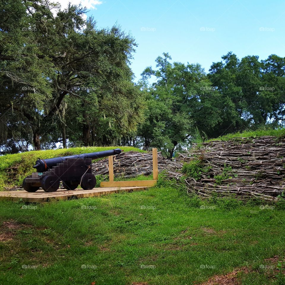 A canon sits lonely on a hill at Charlestown Landing in Charleston, South Carolina.