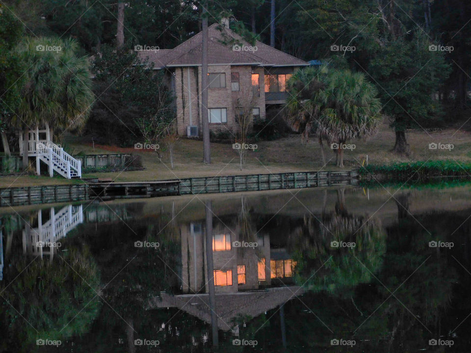 Lights reflecting off the calm lake