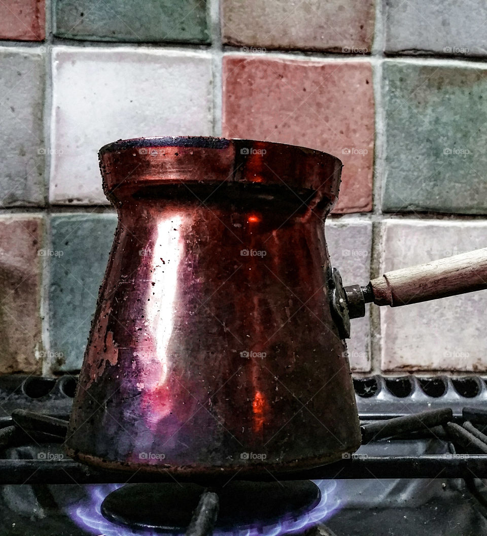 An old coffee pot on a stove