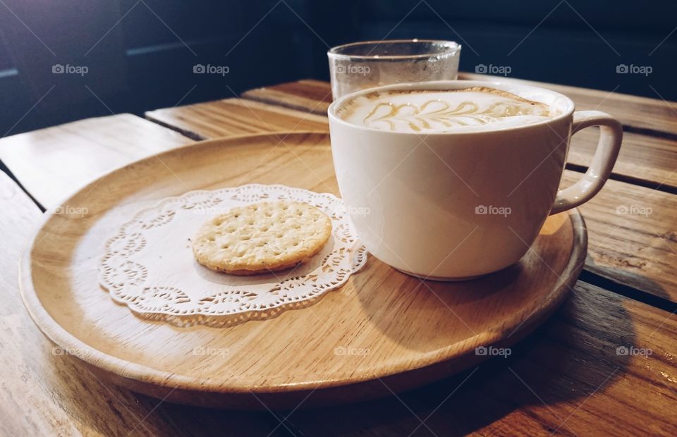 Hot coffee cup with biscuits