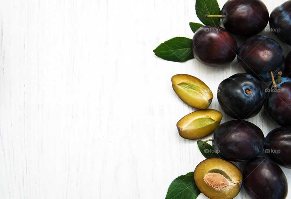 Plums on a wooden table 