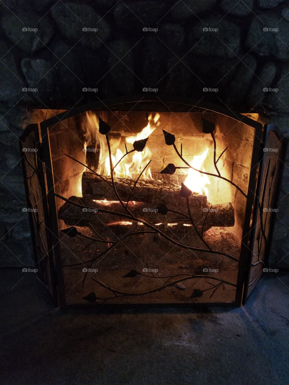 Beautiful fire in a hundred year old fieldstone fireplace.