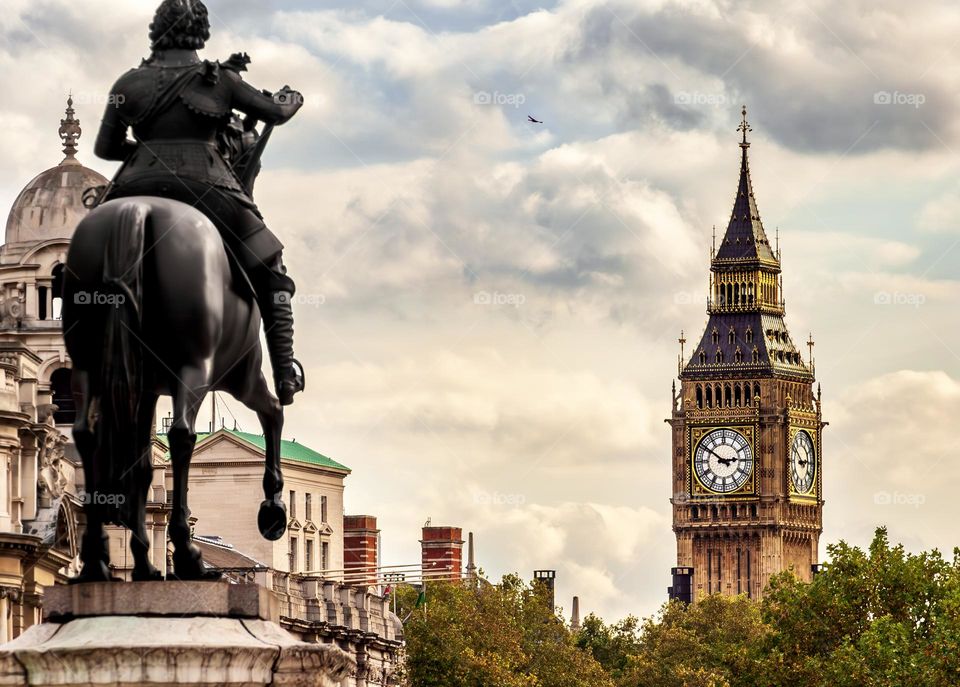 A statue of Charles I looks over to Elizabeth Tower, the home of Big Ben in London