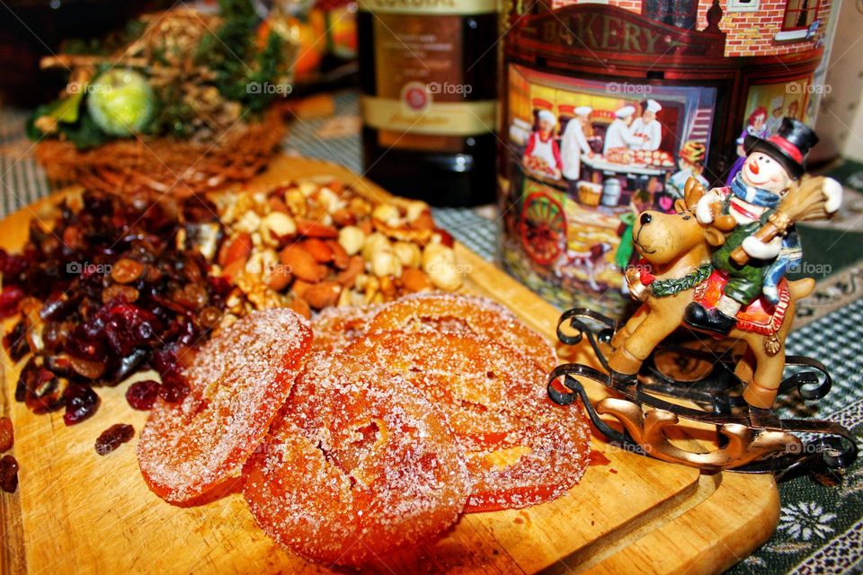 Happy New Year and Merry Christmas. Christmas decorations. Fir branches, shiny balls, garlands, lights and lanterns. gingerbread, dried fruits, nuts. Preparing for Christmas at home and on the streets.