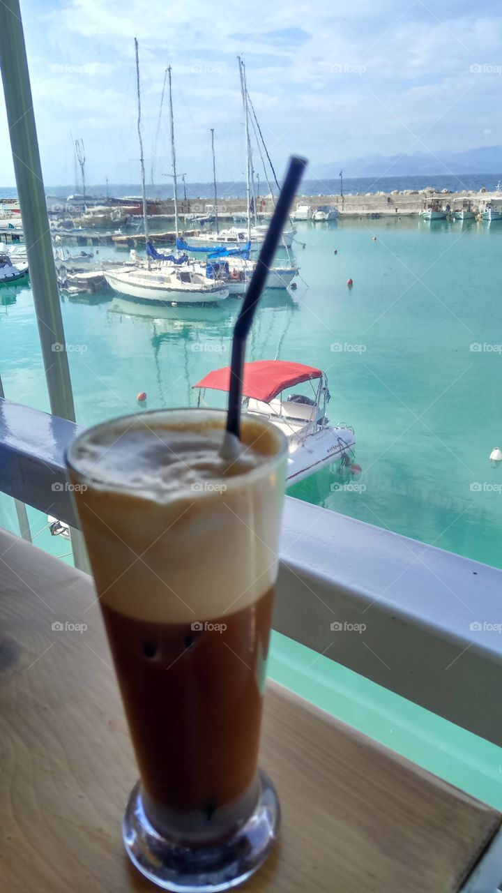 drinking a coffee by the sea