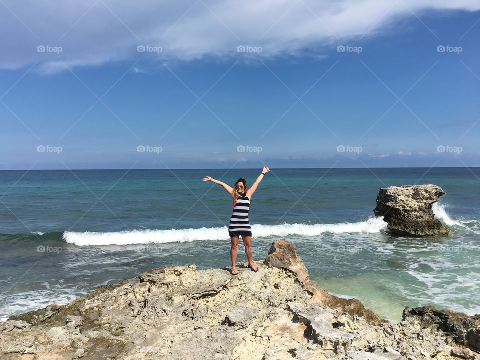Girl Standing on Cliff in Caribbean