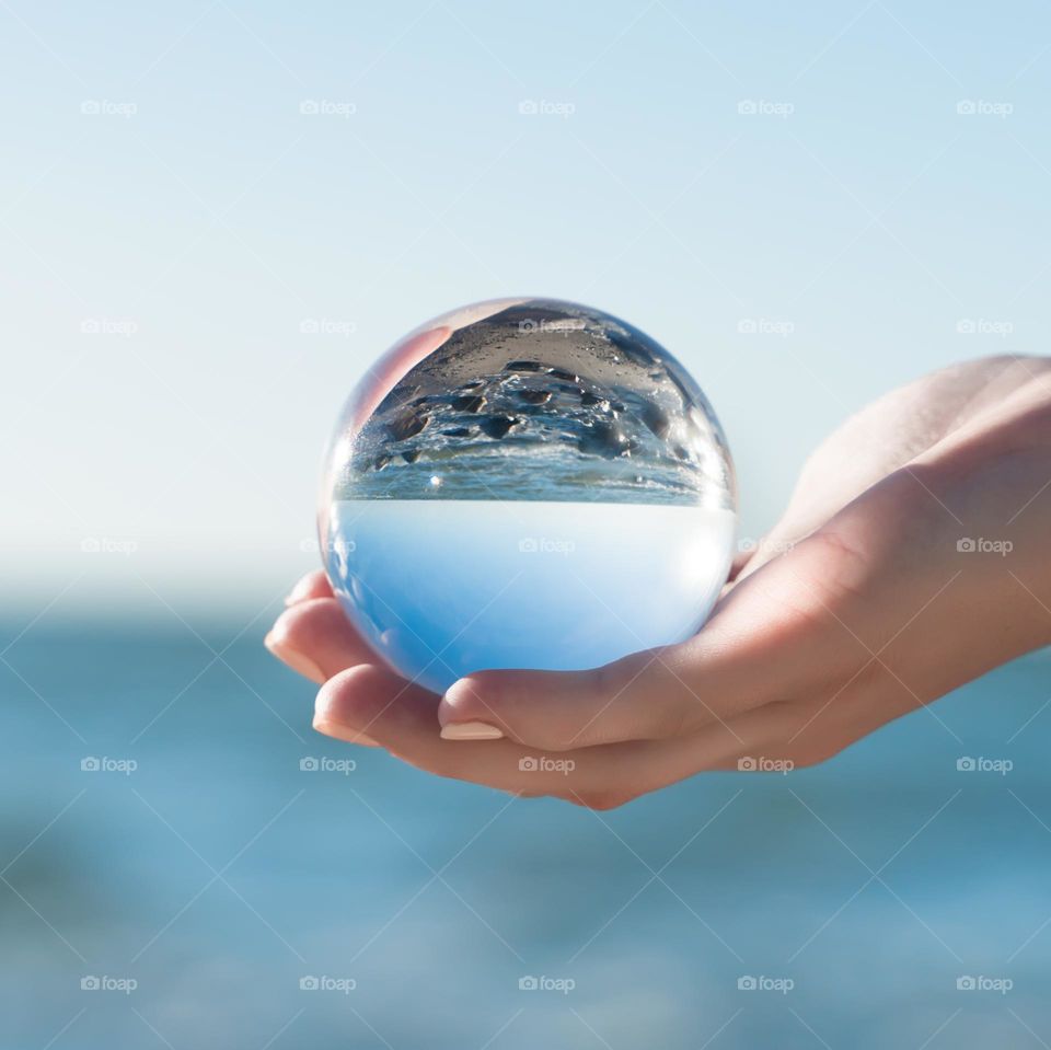 glass ball in female hand