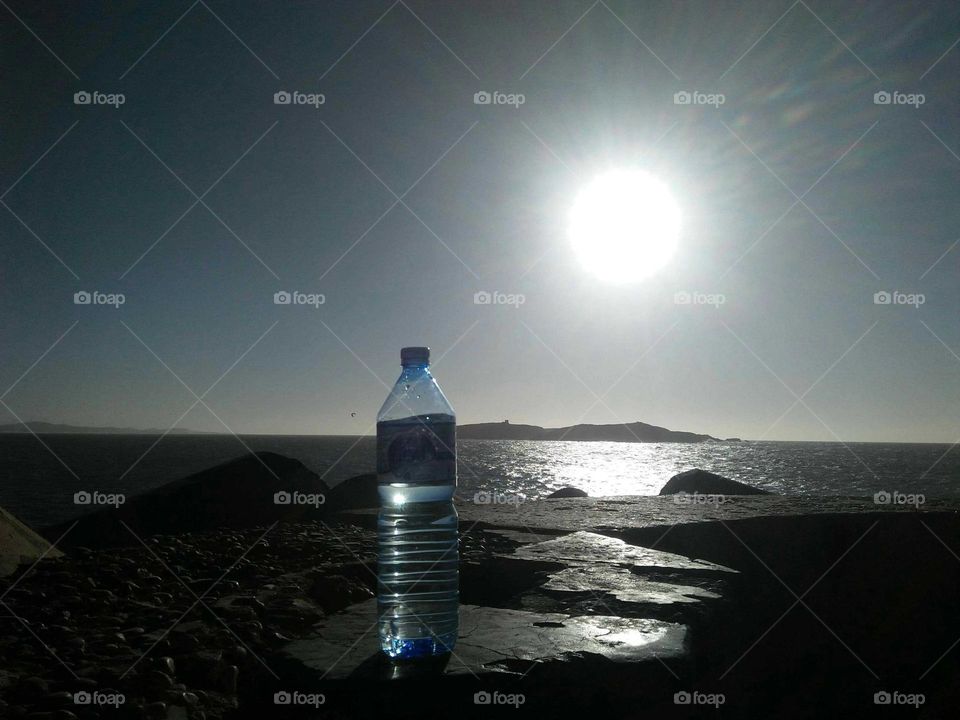 A bottle against sunset