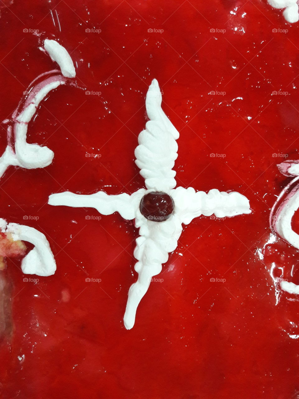 red strawberry  smoothie creamy  cream plus cherry centre handmade. close-up view