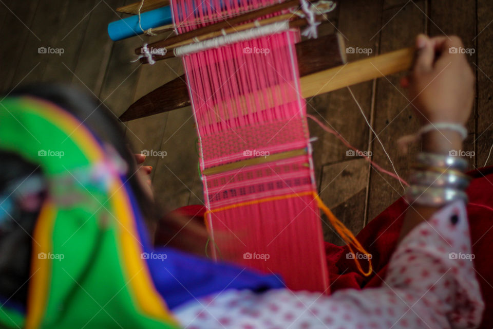 Close-up of woman weaving