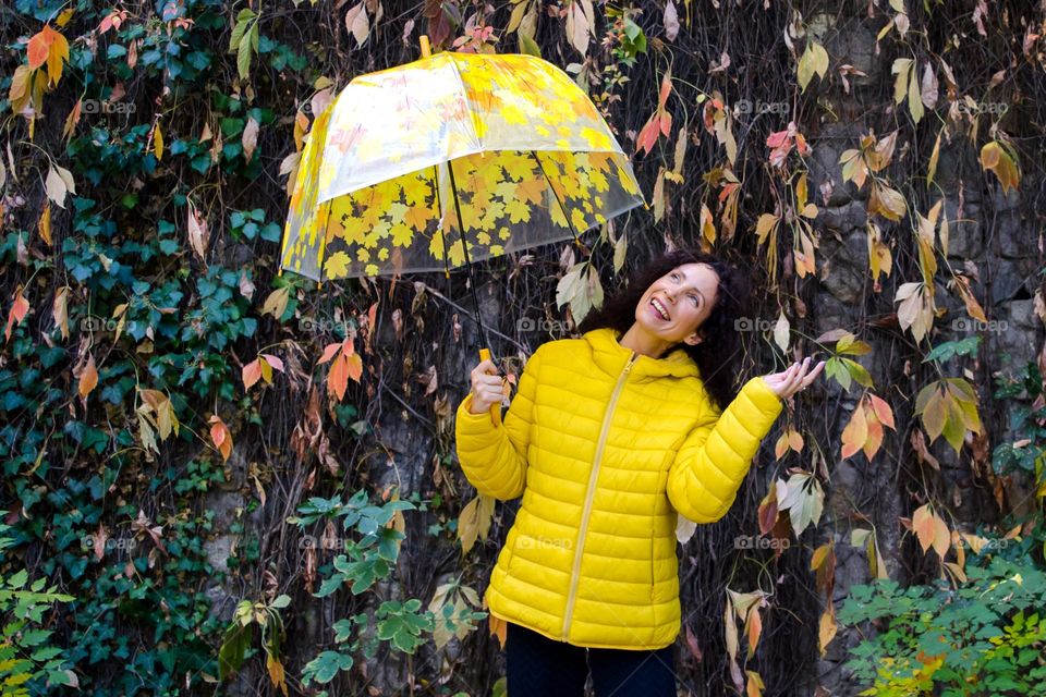 Smiling Young Girl on Autumn Background