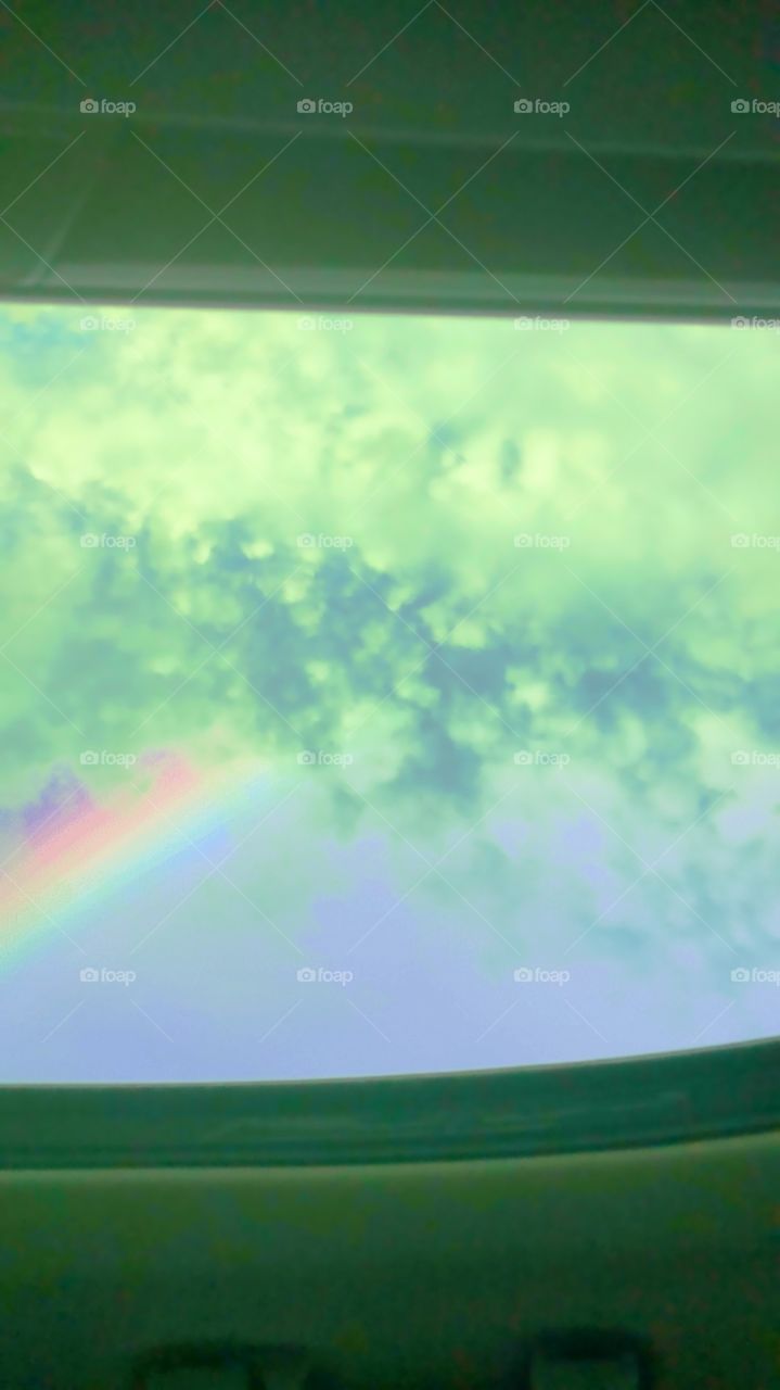 Sky and rainbow with clouds