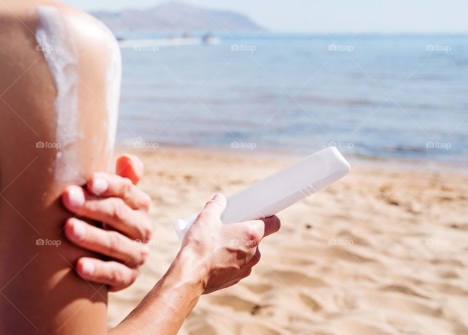 woman hand holding beauty products