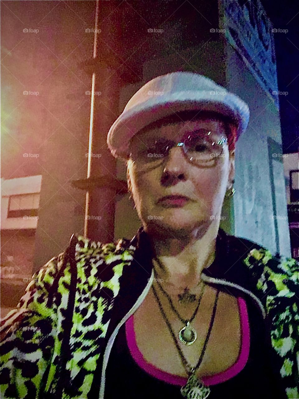 On a late night outing to shop at the 24 hr supermarket across the Pulaski Bridge in Greenpoint, Bklyn, New York I snapped this selfie illuminated in the street lights and neon lights underneath the bridge. Photo 2020. Hypnotic Productions