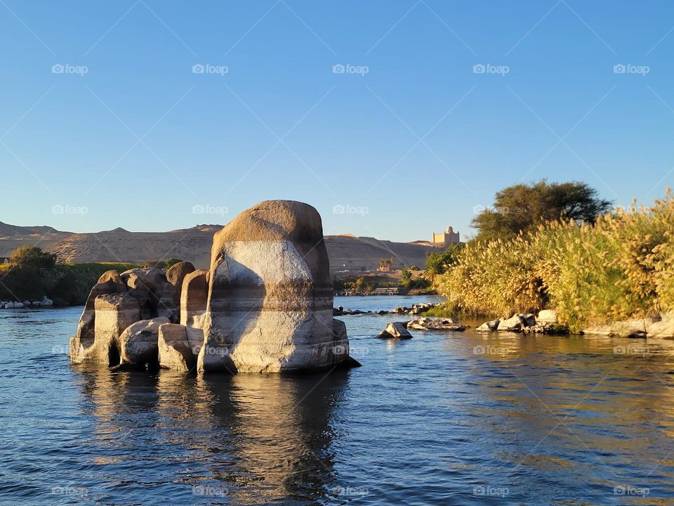 rocks seen during boat ride sailing down the Nile River at Aswan Egypt