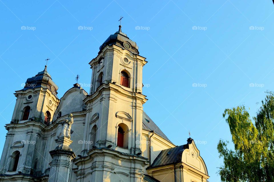 Clear blue sky above the historic church in Poland