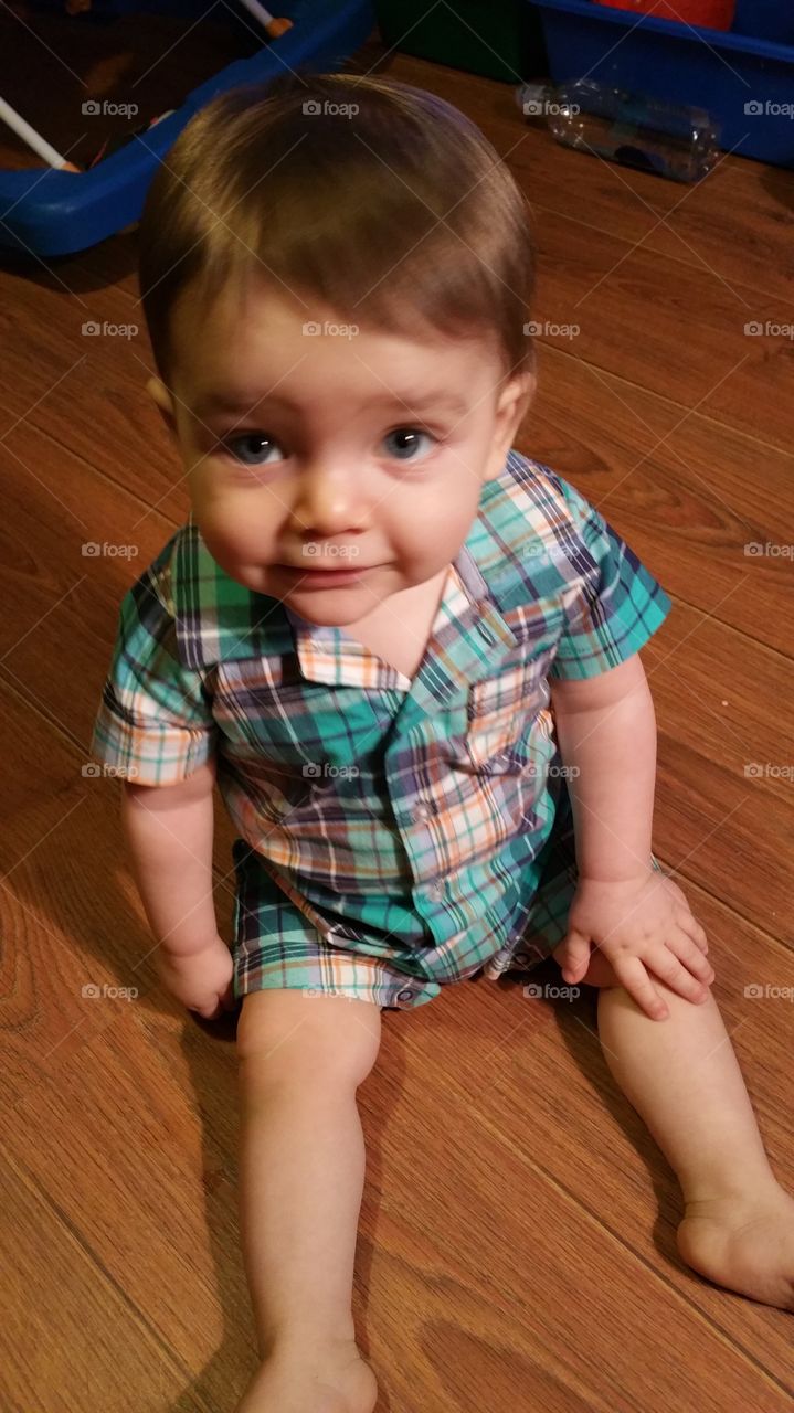 Baby boy giving a cute facial expression.