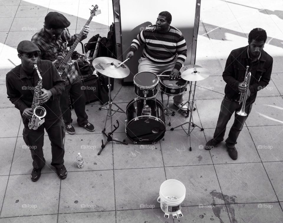 Chicago street music. Performers in Chicago , playing jazz/blues music on a street corner , great music and group!