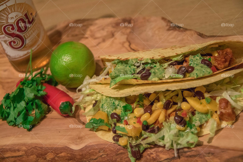 Homemade tacos with guacamole and black beans 