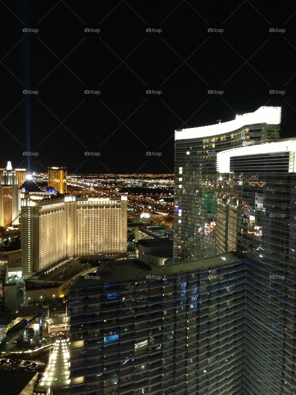 Las Vegas as seen from Cosmo . Aria, beam of light from the Luxor, Mandalay  Bay in background. 