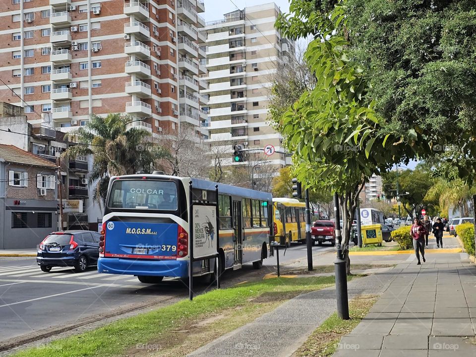 Bus about to reach the bus stop to pick up and drop off commuters