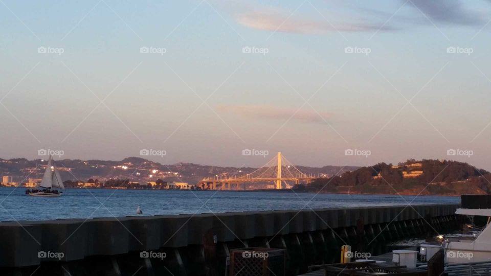 San Francisco Francisco gate bridge at sun set from across the bay
