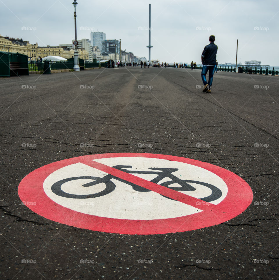Brighton and Hove promenade with big no cycling / bike symbol