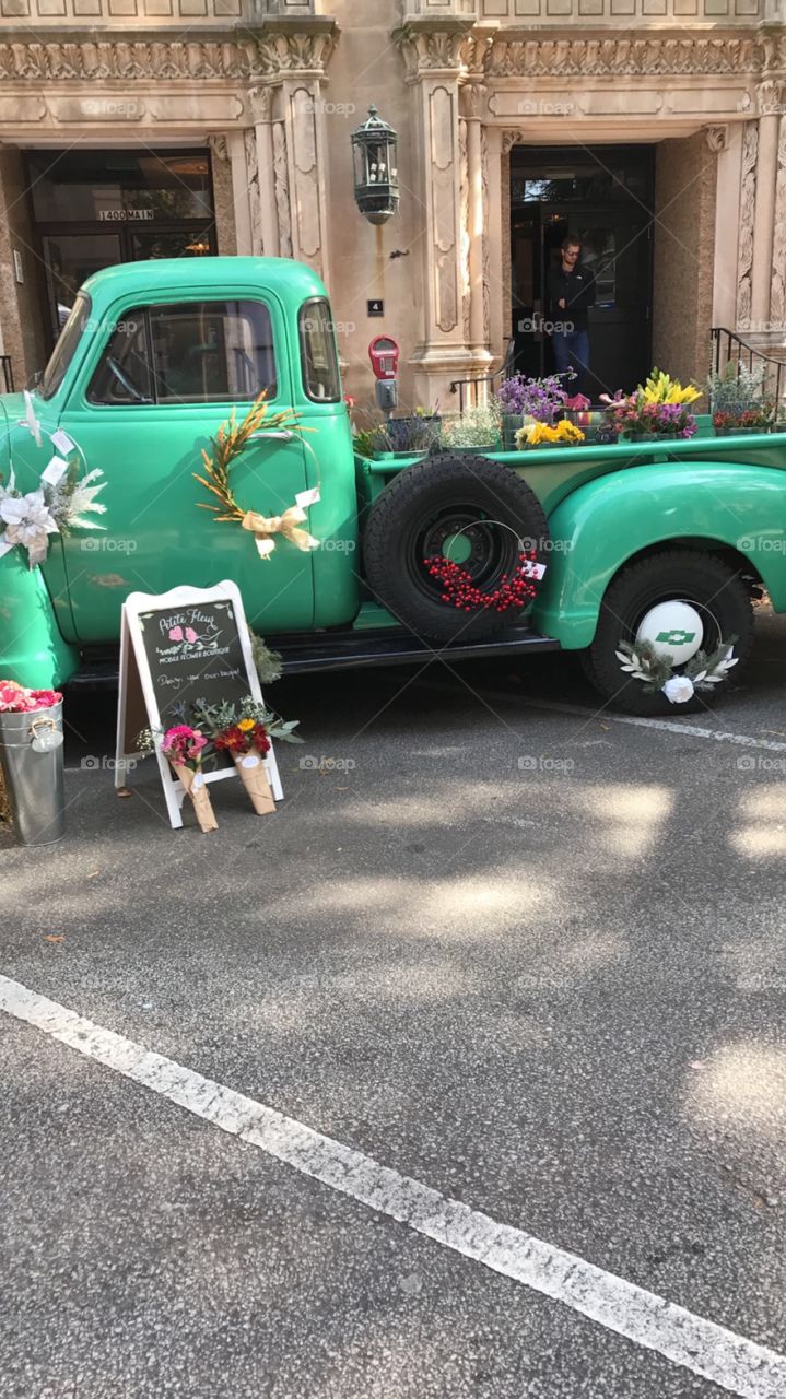 pick up truck selling flowers in the city 
