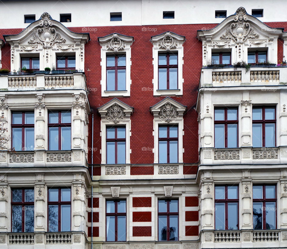 Casement windows of red colored  brick building in Berlin, Germany.