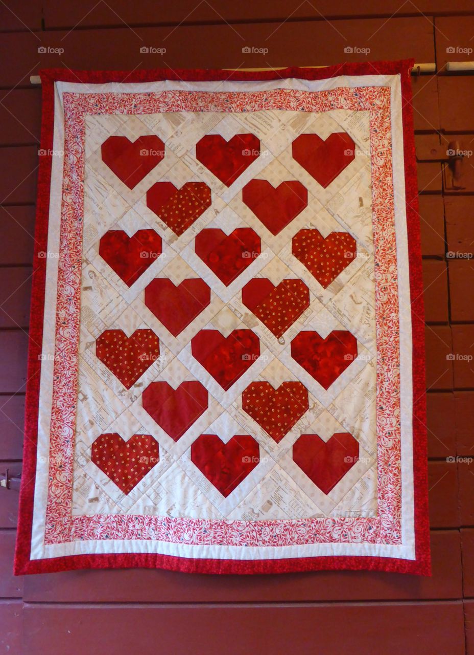 red blanket with hearts