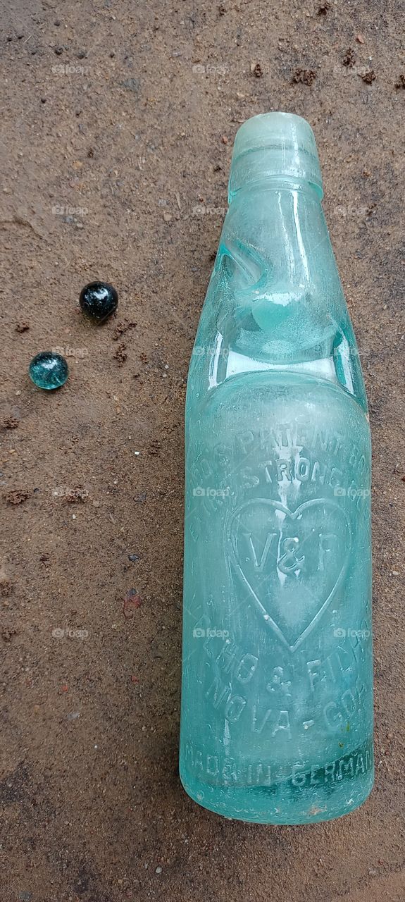 codd bottle with to marbles in send