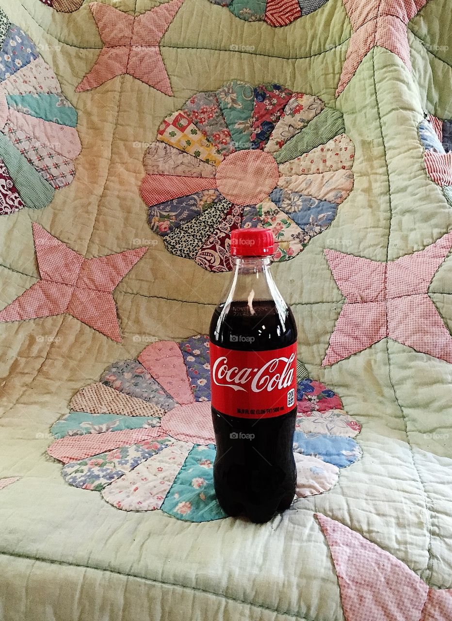 Coca-Cola on an antique quilt