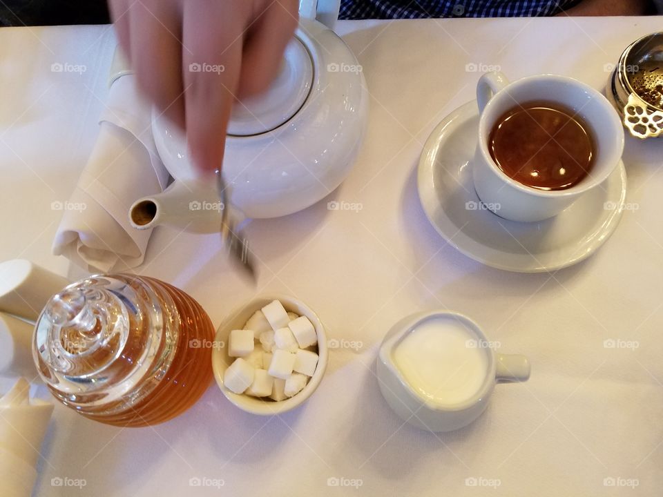 Working Hands Serving Tea